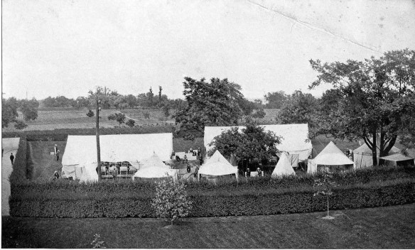 Black and white photograph of tent city and grounds from a New York psychiatric facility dated 1901