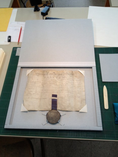 A certificate and seal, re-housed.