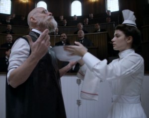 Dr. Christiansen (Matt Frewer) preps his beard for surgery, assisted by Nurse Elkins (Eve Hewson). Courtsey of HBO-Cinemax.