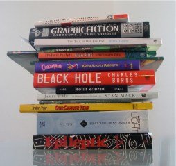 Stack of medically-themed graphic novels. Photo by Ian Williams.