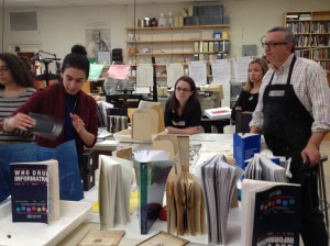 Puzzling over what to do with materials. Alan Galicki supervises, far right.