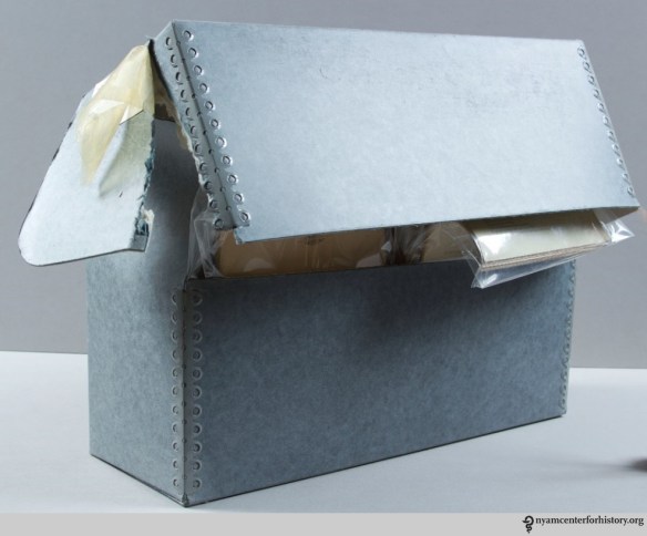A damaged document box housing health pamphlets.