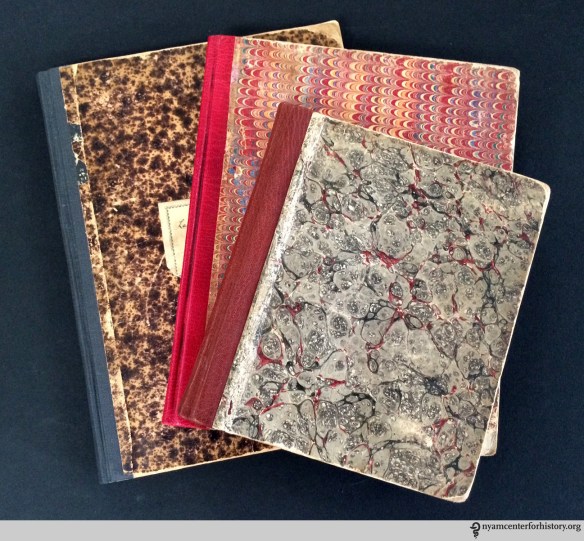 Three ready-made notebooks after conservation treatment.