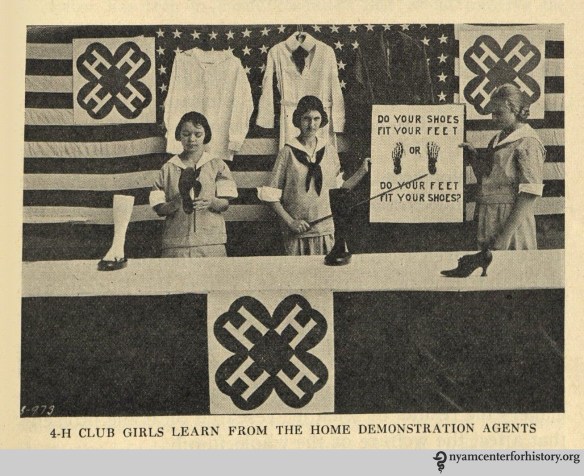 "4-H girls club learn from the home demonstration agents." In The Goal of May Day, 1928.