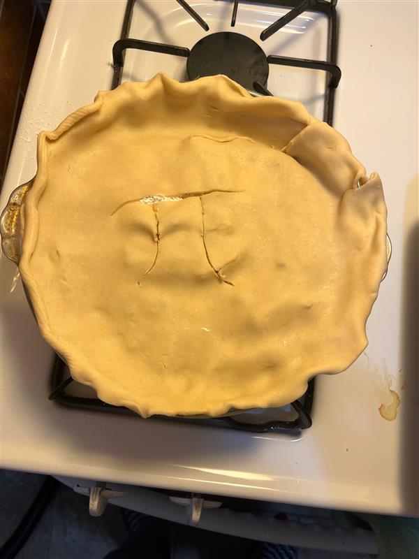 The pie completed before it was baked. On top is the pi symbol carved in.